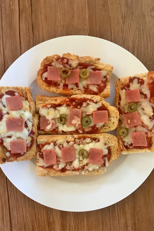 Air Fryer French Bread Pizza in White plate, Mom Food Blog