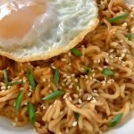 spicy garlic noodles with egg on top, mom food blog